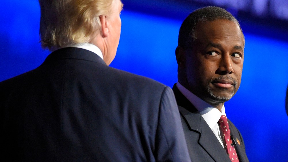 Ben Carson watches as Donald Trump takes the stage during the CNBC Republican presidential debate at the University of Colorado, Oct. 28, 2015, in Boulder, Colo. (Photo by Mark J. Terrill/AP)