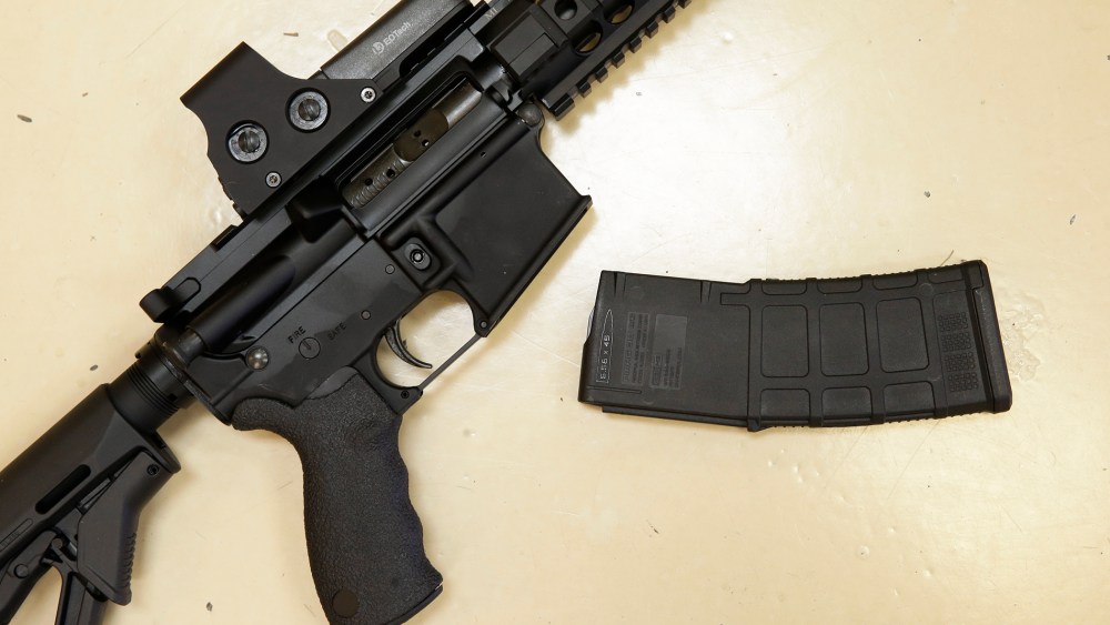In this Oct. 3, 2013, file photo, a custom-made semi-automatic hunting rifle with a high-capacity detachable magazine is displayed at TDS Guns in Rocklin, Calif. (Photo by Rich Pedroncelli/AP)