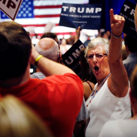 A woman turn around and gestures to the news media as former Alaska Gov. Sarah Palin talks about the news media at Donald Trump's campaign event in Tampa, Fla., March 14, 2016. (Photo by Gerald Herbert/AP)
