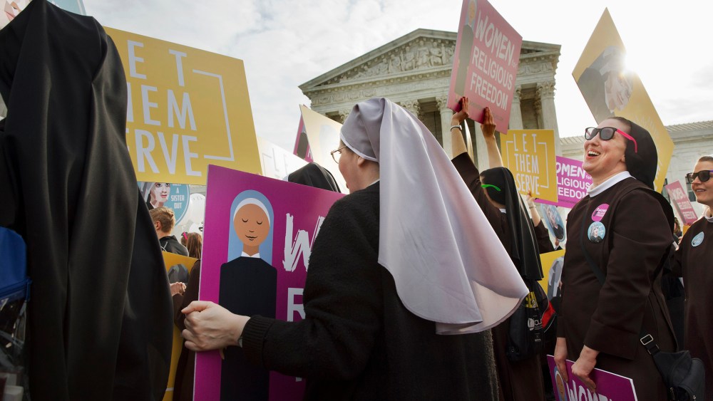 Nuns of the Order of St. Francis, from Mishawaka, Ind., rally outside the Supreme Court in Washington, March 23, 2016. (Photo by Jacquelyn Martin/AP)
