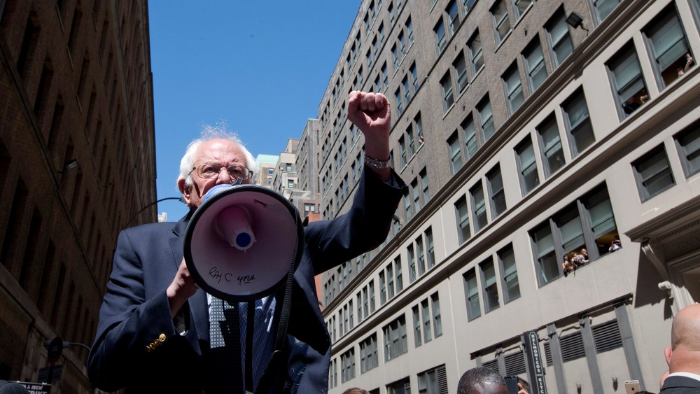 Democratic presidential candidate Sen. Bernie Sanders, I-Vt. speaks to Communication Workers of America (CWA) picketers in midtown Manhattan, N.Y., April 18, 2016. (Photo by Mary Altaffer/AP)