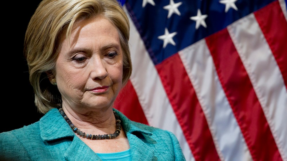 Democratic presidential candidate Hillary Clinton pauses as she is introduced to speak at the Brookings Institution in Washington on Sept. 9, 2015. (Photo by Carolyn Kaster/AP)