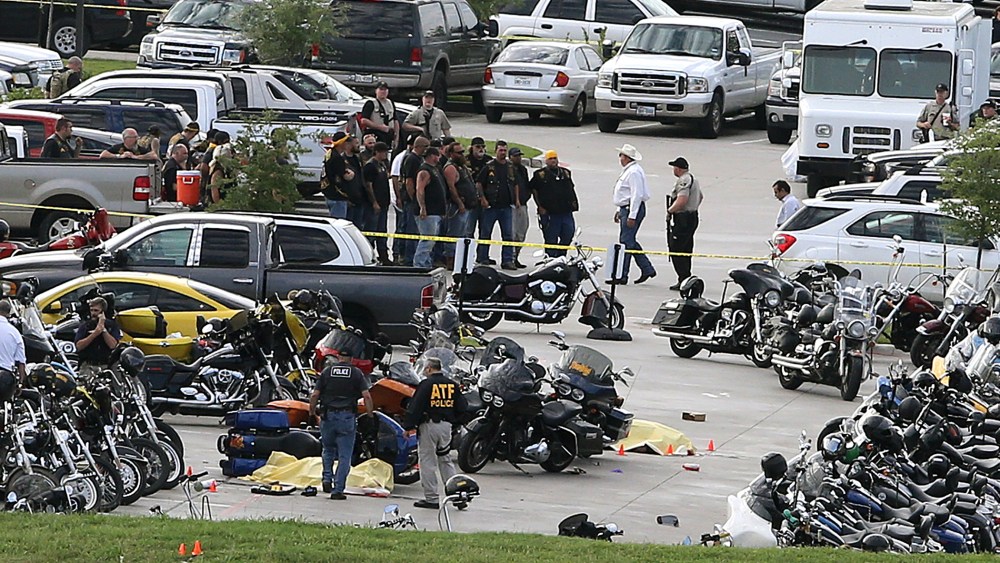 In this May 17, 2015 file photo, authorities investigate a shooting in the parking lot of the Twin Peaks restaurant, in Waco, Texas. (Photo by Jerry Larson/AP)