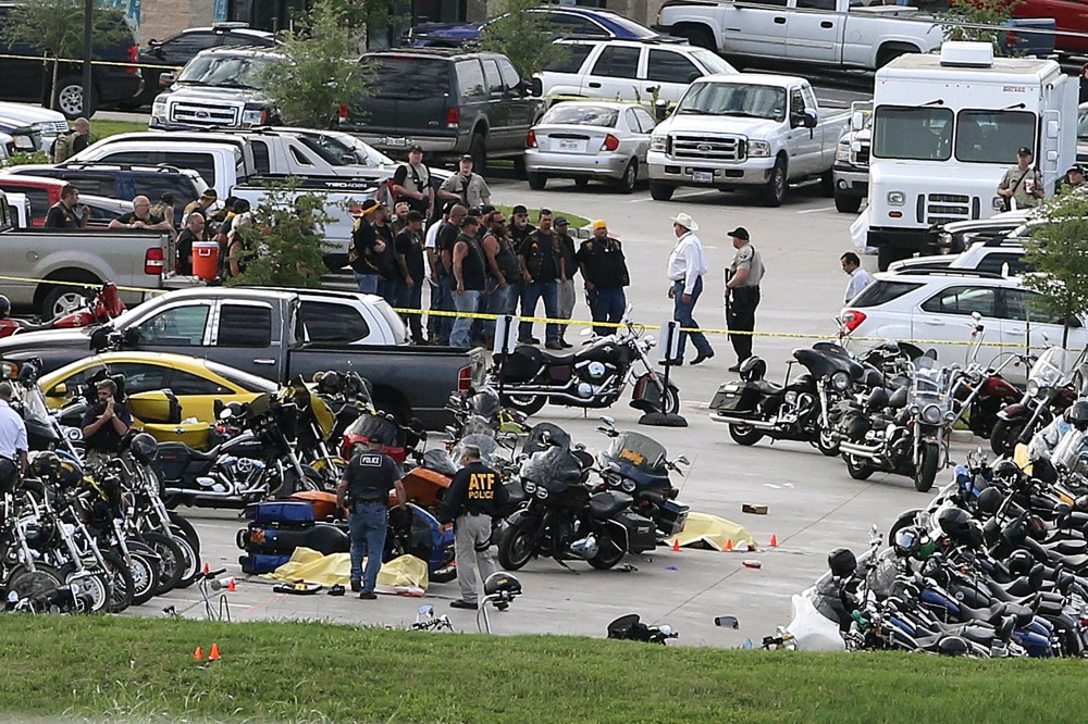 In this May 17, 2015 file photo, authorities investigate a shooting in the parking lot of the Twin Peaks restaurant, in Waco, Texas. (Photo by Jerry Larson/AP)