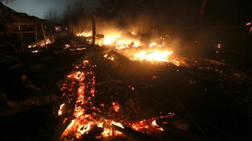 The remains of a home burn early in the morning on April 18, 2013, after a fertilizer plant exploded in West, Texas. (Photo by LM Otero/AP)