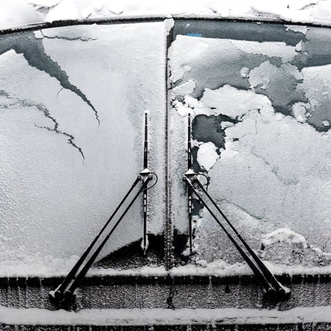 A bus window is covered by snow and ice, Feb. 14, 2016, in Evanston, Ill. (Photo by Nam Y. Huh/AP)
