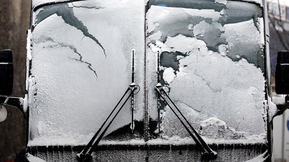 A bus window is covered by snow and ice, Feb. 14, 2016, in Evanston, Ill. (Photo by Nam Y. Huh/AP)