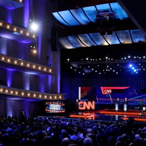 Democratic presidential candidates Hillary Clinton, left, and, Sen. Bernie Sanders listen to a question during a Democratic presidential primary debate at the University of Michigan-Flint on March 6, 2016, in Flint, Mich. (Photo by Carlos Osorio/AP)