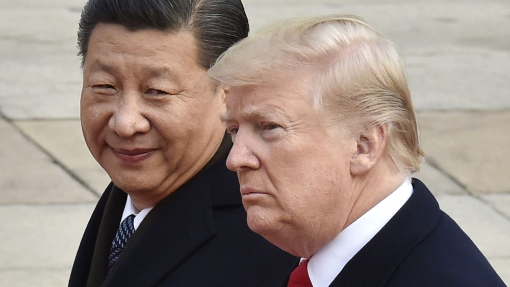 File photo taken in November 2017 shows U.S. President Donald Trump (and Chinese President Xi Jinping attending a welcome ceremony in Beijing.