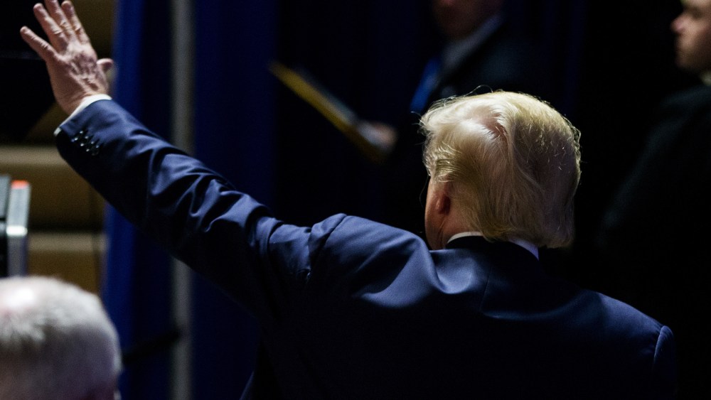 Republican presidential candidate Donald Trump waves to members of the audience as he departs after speaking at a rally at Muscatine High School in Muscatine, Iowa, Jan. 24, 2016. (Photo by Andrew Harnik/AP)