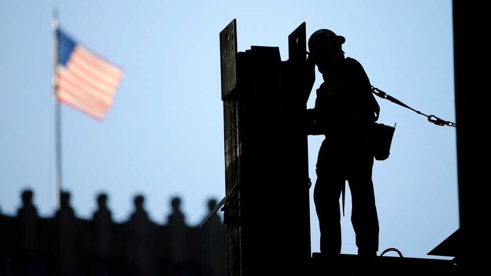 In this Sept. 15, 2015 photo, an iron worker works on a construction site in Philadelphia. (Photo by Matt Rourke/AP)