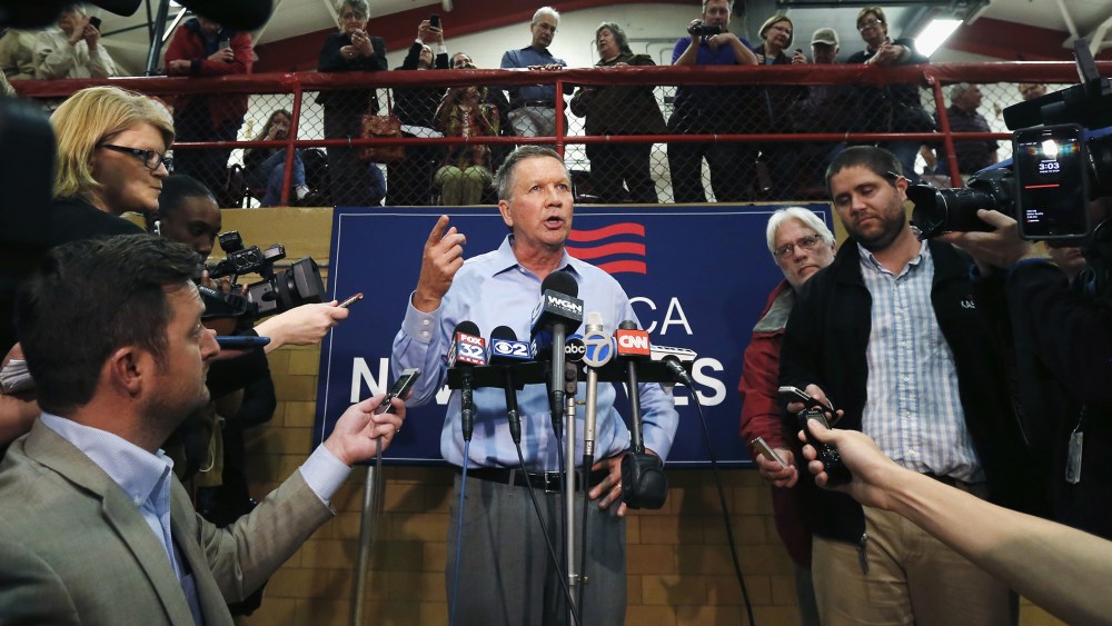 Republican presidential candidate, Ohio Gov. John Kasich responds to a reporter's question after a town hall meeting, March 9, 2016, in Palatine, Ill. (Photo by Charles Rex Arbogast/AP)