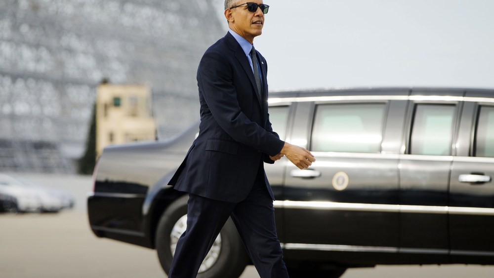 President Barack Obama walks to board Air Force One at Moffett Federal Airfield in Mountain View, Calif., Feb. 11, 2016. (Photo by Pablo Martinez Monsivais/AP)