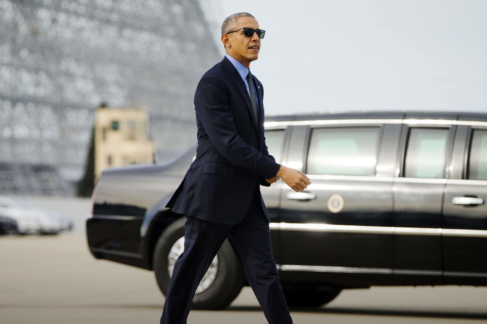 President Barack Obama walks to board Air Force One at Moffett Federal Airfield in Mountain View, Calif., Feb. 11, 2016. (Photo by Pablo Martinez Monsivais/AP)