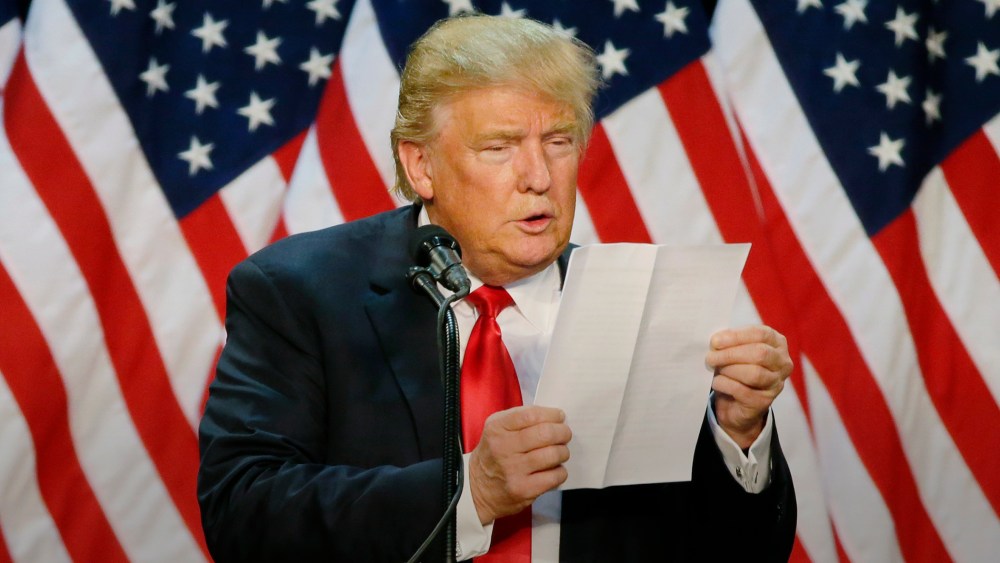 Republican presidential candidate Donald Trump looks at a sheet of notes and talking points as he speaks during a rally in Eugene, Ore., May 6, 2016. (Photo by Ted S. Warren/AP)