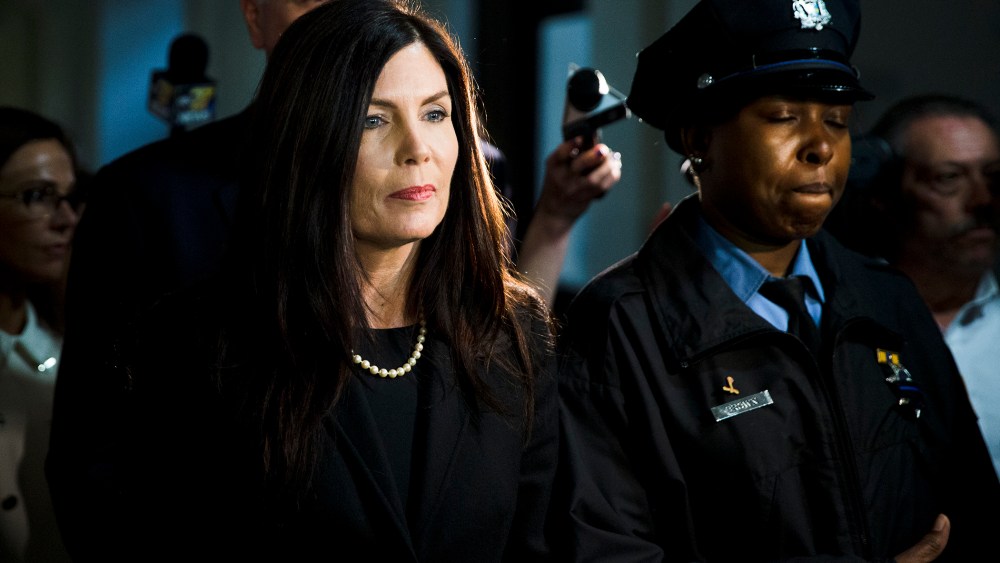 Pennsylvania Attorney General Kathleen Kane walks from the State Supreme Court room on Mar. 11, 2015, at City Hall in Philadelphia (Photo by Matt Rourke/AP).