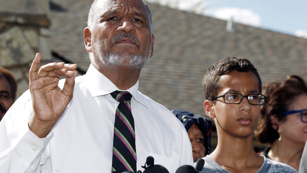 Ahmed Mohamed, 14, right, and his father Mohamed Elhassan Mohamed, left, thank supporters during a news conference at their home, Sept. 16, 2015, in Irving, Tex. (Photo by Brandon Wade/AP)