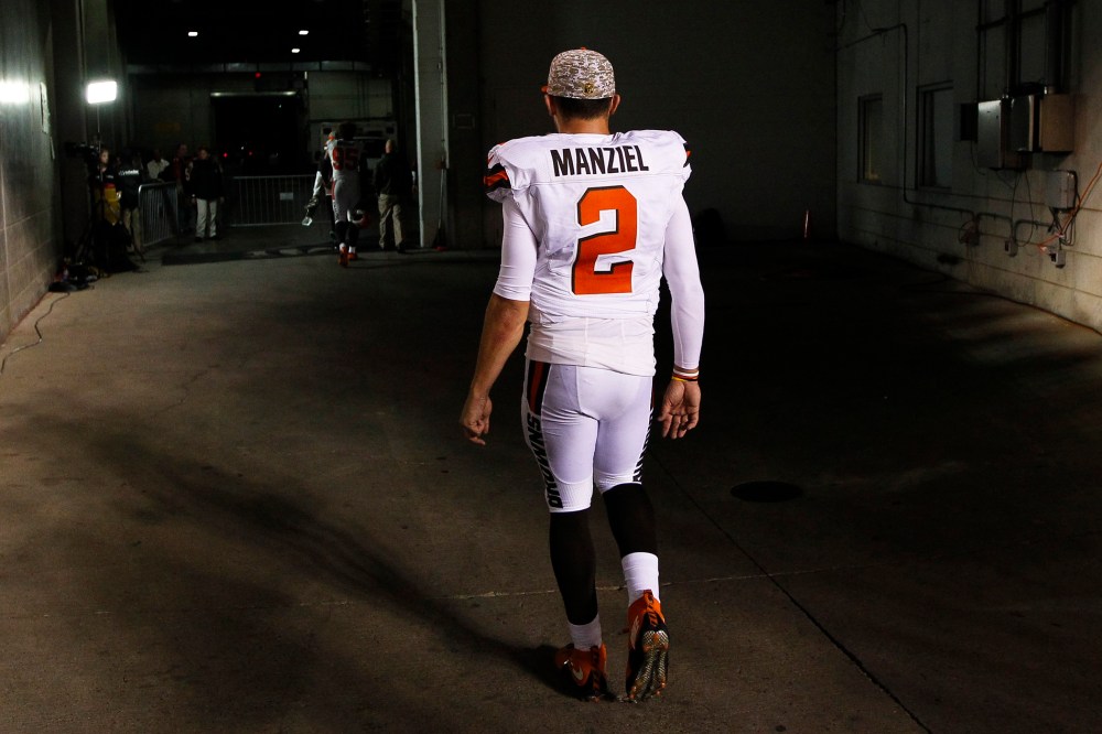 In this Nov. 5, 2015, file photo, Cleveland Browns quarterback Johnny Manziel walks off the field after an 31-10 loss to the Cincinnati Bengals, in Cincinnati. (Photo by Frank Victores/AP)