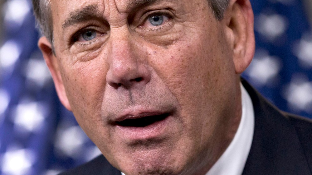 House Speaker John Boehner of Ohio reacts in animated fashion to criticism by conservative groups of a bipartisan budget bill, December 12, 2013, during a news conference on Capitol Hill in Washington.