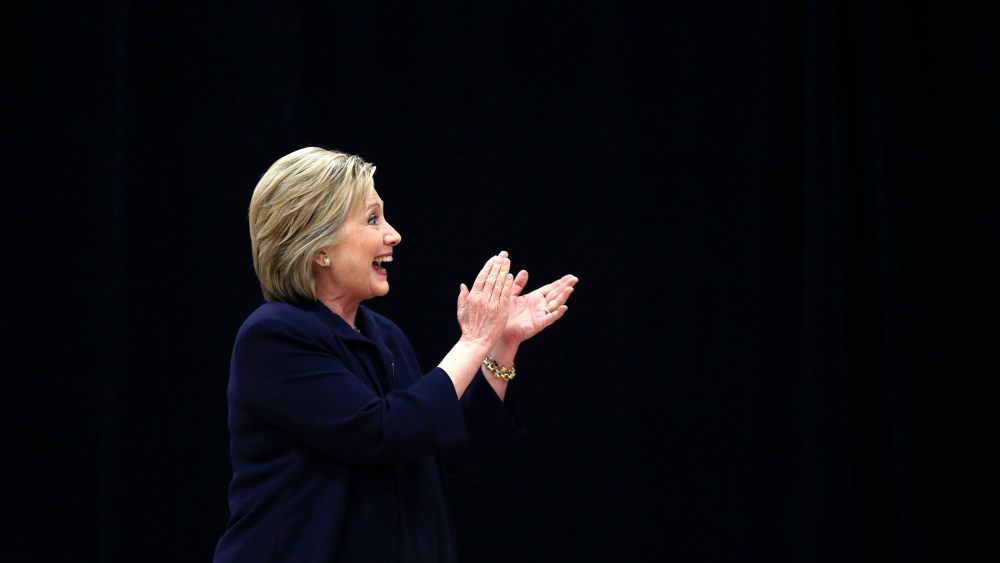 Democratic presidential candidate Hillary Clinton acknowledges the audience as she arrives to speak at a town hall style campaign event at the Williamsburg County Recreation Center in Kingstree, S.C., Feb. 25, 2016. (Photo by Gerald Herbert/AP)