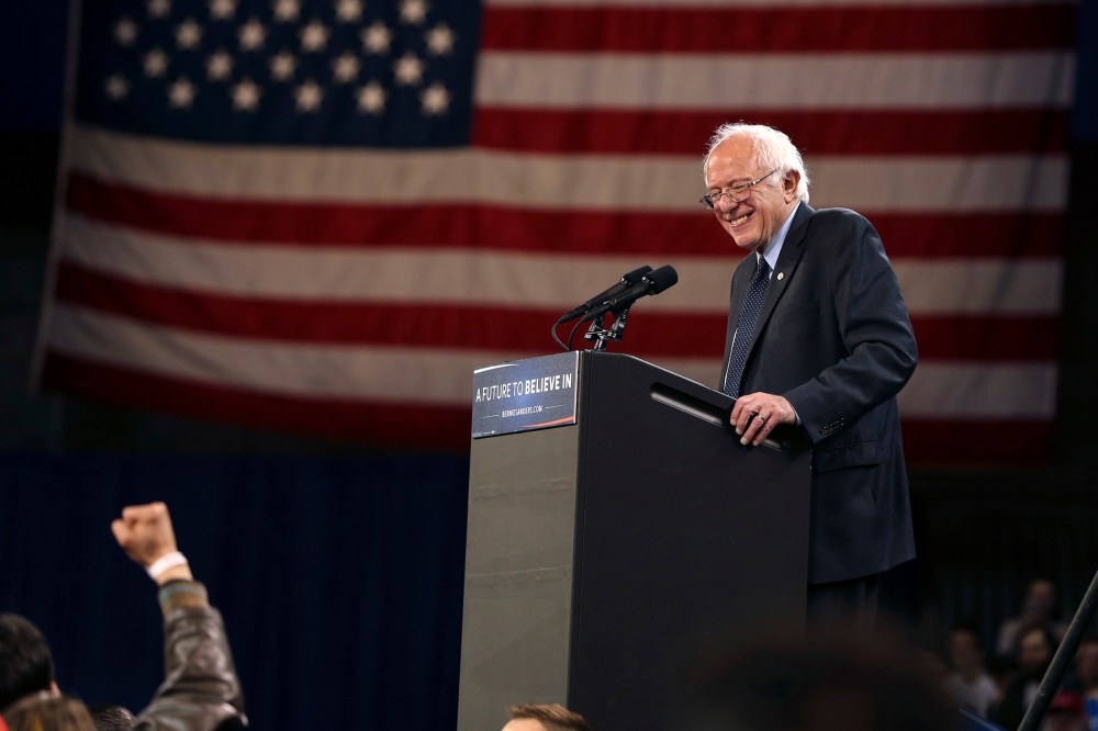 Democratic presidential candidate, Sen. Bernie Sanders, I-Vt., reacts to a fist waving supporter as he speaks at a campaign rally, April 11, 2016, in Buffalo, N.Y. (Photo by Mel Evans/AP)