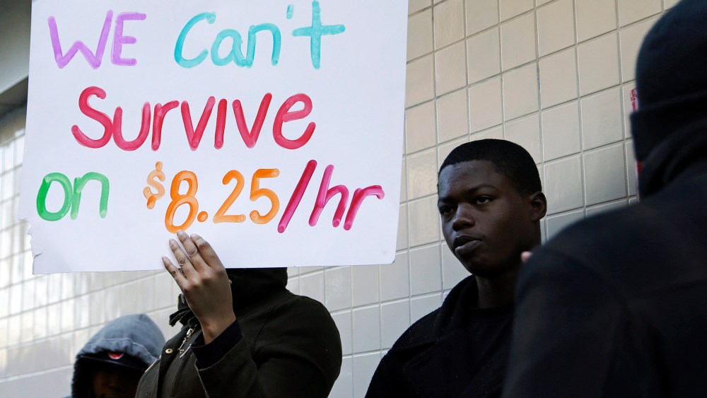 Protestors demonstrate outside a McDonald's restaurant on Thursday, Dec. 5, 2013, in Oakland, California.