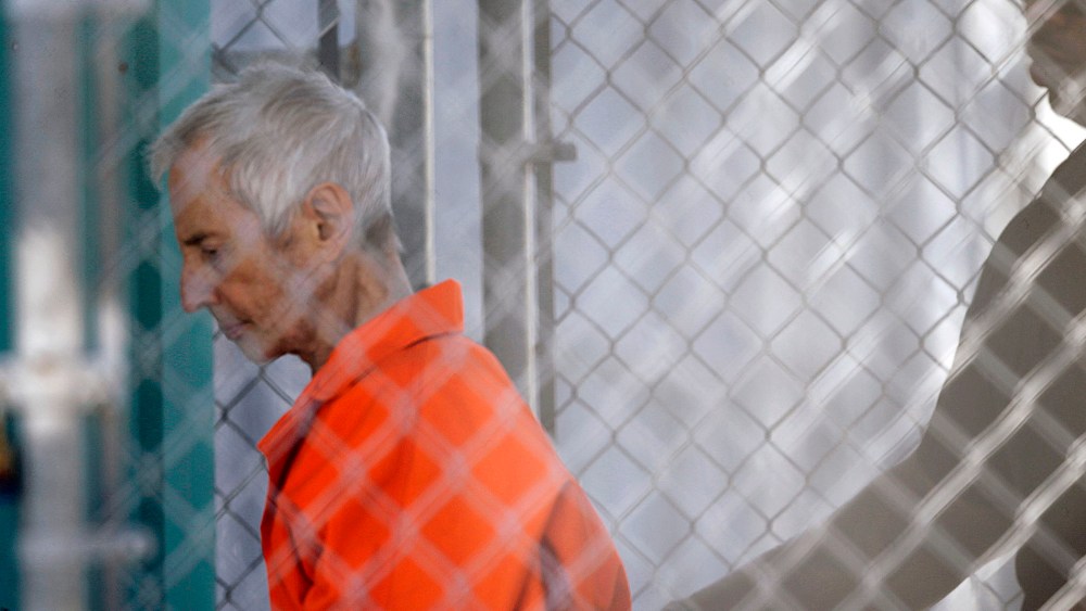 Robert Durst is escorted into Orleans Parish Prison after his arraignment in Orleans Parish Criminal District Court in New Orleans, on March 17, 2015.