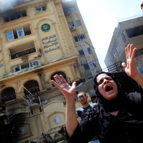 An Egyptian woman chants slogans, as protesters ransack the Muslim Brotherhood headquarters in the Muqattam district in Cairo, Monday, July 1, 2013. Protesters stormed and ransacked the headquarters of President Mohammed Morsi's Muslim Brotherhood...