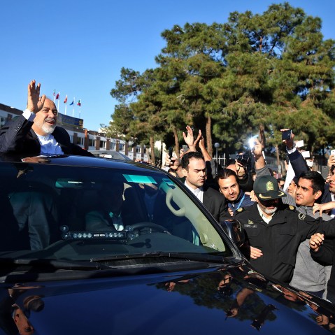 Iranian Foreign Minister Mohammad Javad Zarif, who is also Iran's top nuclear negotiator, waves to his well wishers upon arrival at the Mehrabad airport in Tehran, Iran, from Lausanne, Switzerland, April 3, 2015. (Photo by Ebrahim Noroozi/AP)