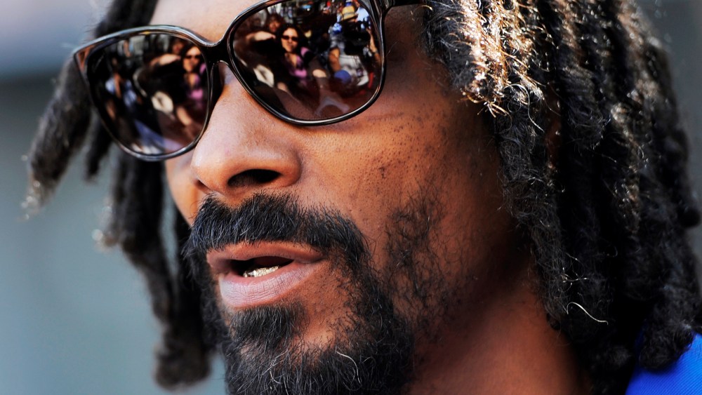 Snoop Lion is interviewed at a party in Los Angeles, June 12, 2013.