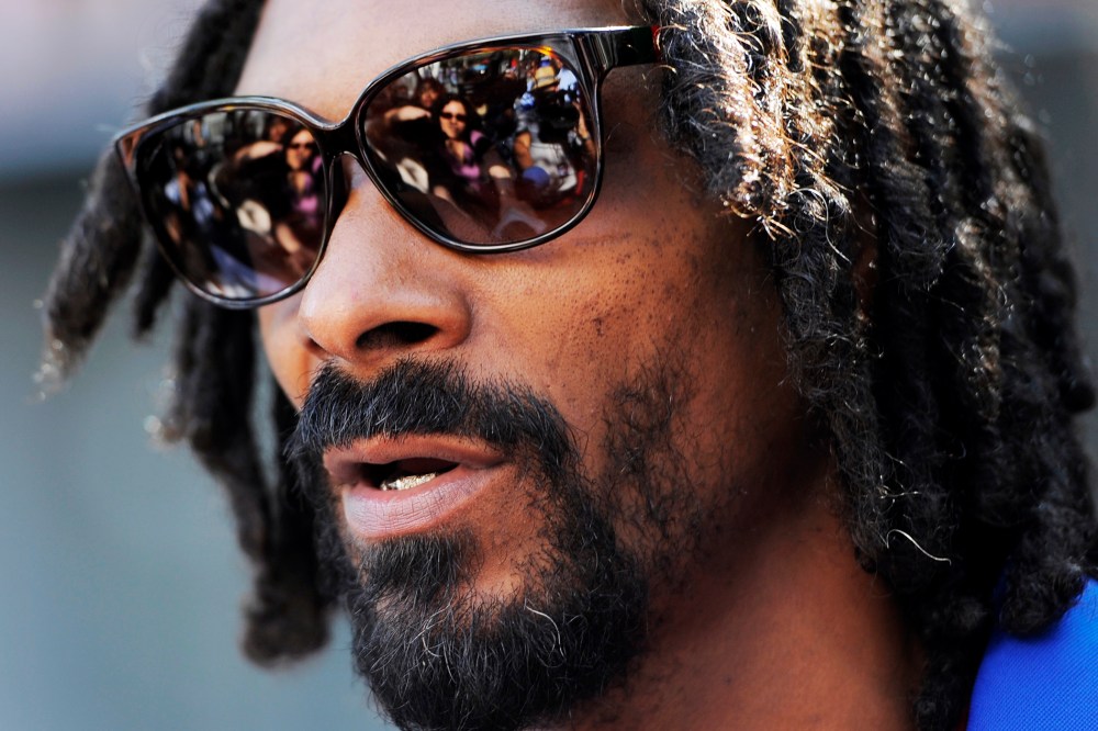 Snoop Lion is interviewed at a party in Los Angeles, June 12, 2013.