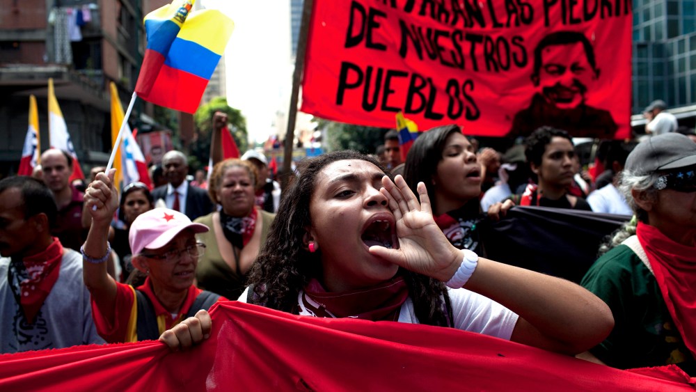 Members of a pro-government "colectivo," or "collective," march in downtown Caracas, Venezuela, on  Feb. 20, 2014.