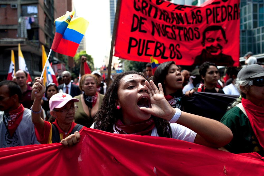 Members of a pro-government "colectivo," or "collective," march in downtown Caracas, Venezuela, on  Feb. 20, 2014.