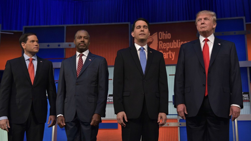 Florida Senator Marco Rubio, retired neurosurgeon Ben Carson, Wisconsin Gov. Scott Walker, and real estate magnate Donald Trump return to the stage following a break in the Republican presidential primary debate on August 6, 2015 at the Quicken Loans Aren