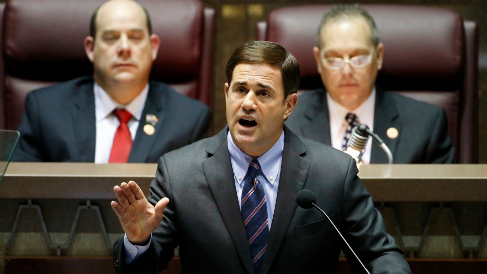 Arizona Republican Gov. Doug Ducey, front, gives his state-of-the-state address on Jan. 12, 2015, in Phoenix. (Photo by Ross D. Franklin/AP)