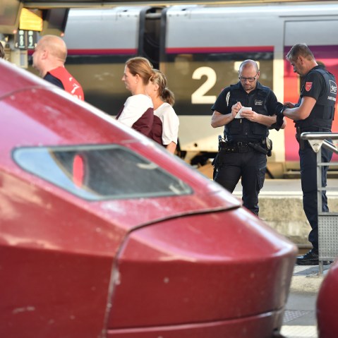 Security agents of French national railway operator SNCF stand next to Thalys trains at the main train station in Arras, northern France, on August 21, 2015. (Photo by Philippe Huguen/AFP/Getty)