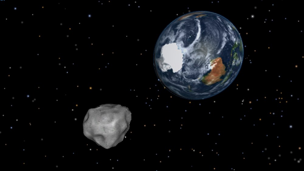 This image provided by NASA/JPL-Caltech shows a simulation of asteroid 2012 DA14 approaching from the south as it passes through the Earth-moon system on Feb. 15, 2013. The 150-foot object will pass within 17,000 miles of the Earth. NASA scientists...