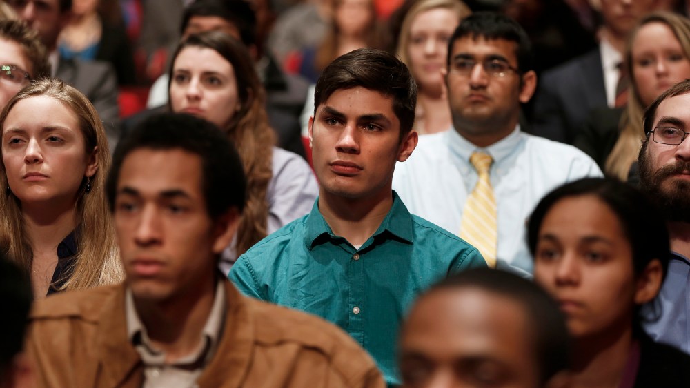 Audience members at American University in Washington DC watch Chris Matthews interview President Obama, Dec. 5, 2013.