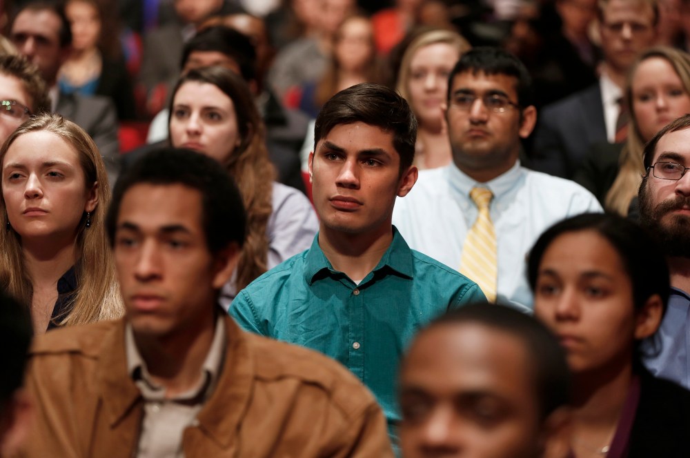 Audience members at American University in Washington DC watch Chris Matthews interview President Obama, Dec. 5, 2013.