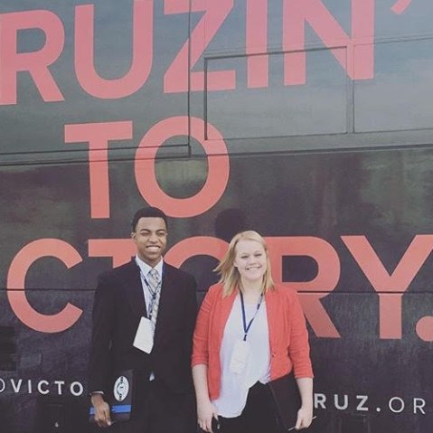 Chase the Race" reporters Mikayla Kelz and Charles Graham outside a Ted Cruz campaign bus in Iowa. (Courtesy of Mikayla Kelz)