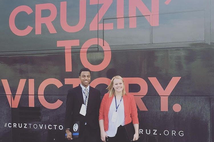 Chase the Race" reporters Mikayla Kelz and Charles Graham outside a Ted Cruz campaign bus in Iowa. (Courtesy of Mikayla Kelz)