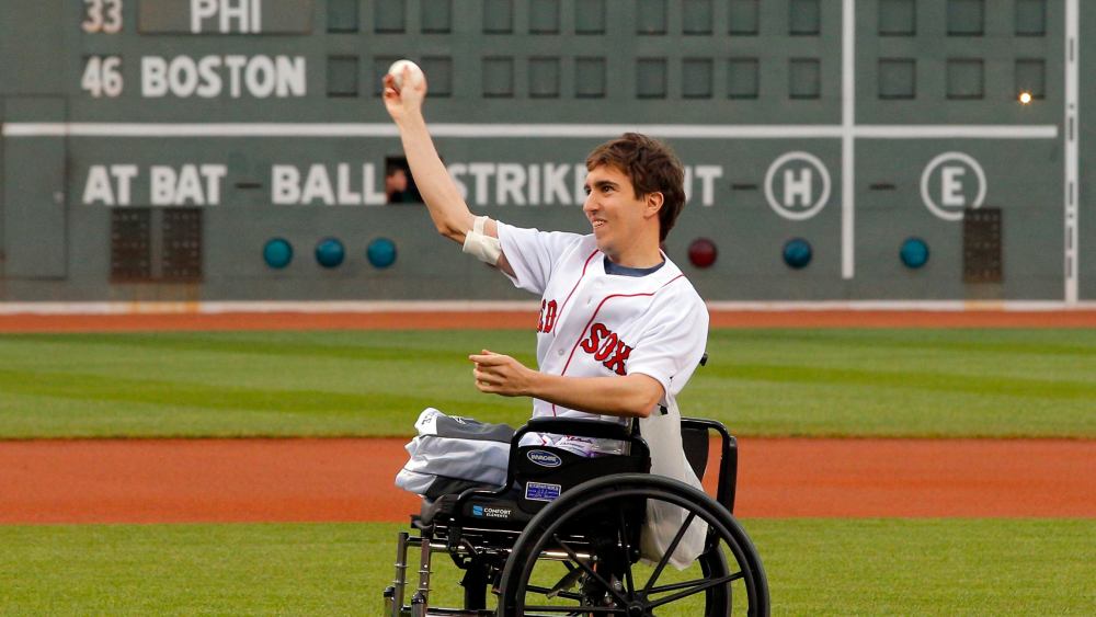 Boston Marathon survivor Jeff Bauman throws out a ceremonial first pitch before the baseball game between the Philadelphia Phillies and the Boston Red Sox at Fenway Park in Boston, Mass., on May 28, 2013. (REUTERS/Brian Snyder)