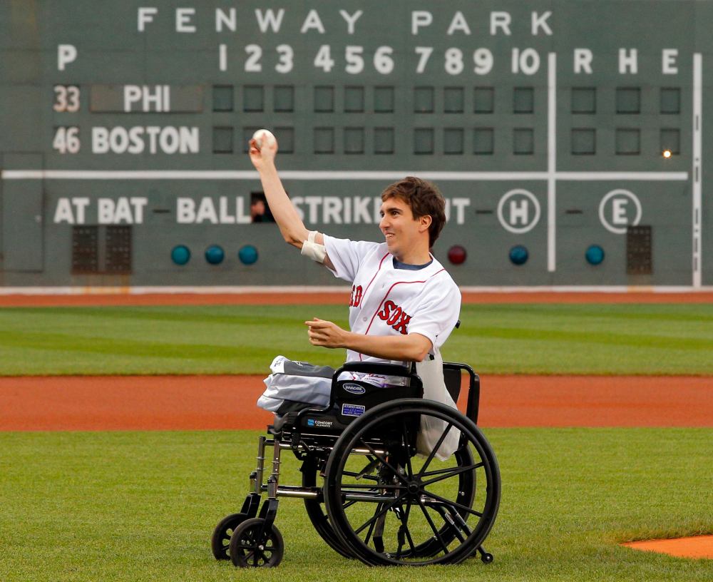 Boston Marathon survivor Jeff Bauman throws out a ceremonial first pitch before the baseball game between the Philadelphia Phillies and the Boston Red Sox at Fenway Park in Boston, Mass., on May 28, 2013. (REUTERS/Brian Snyder)