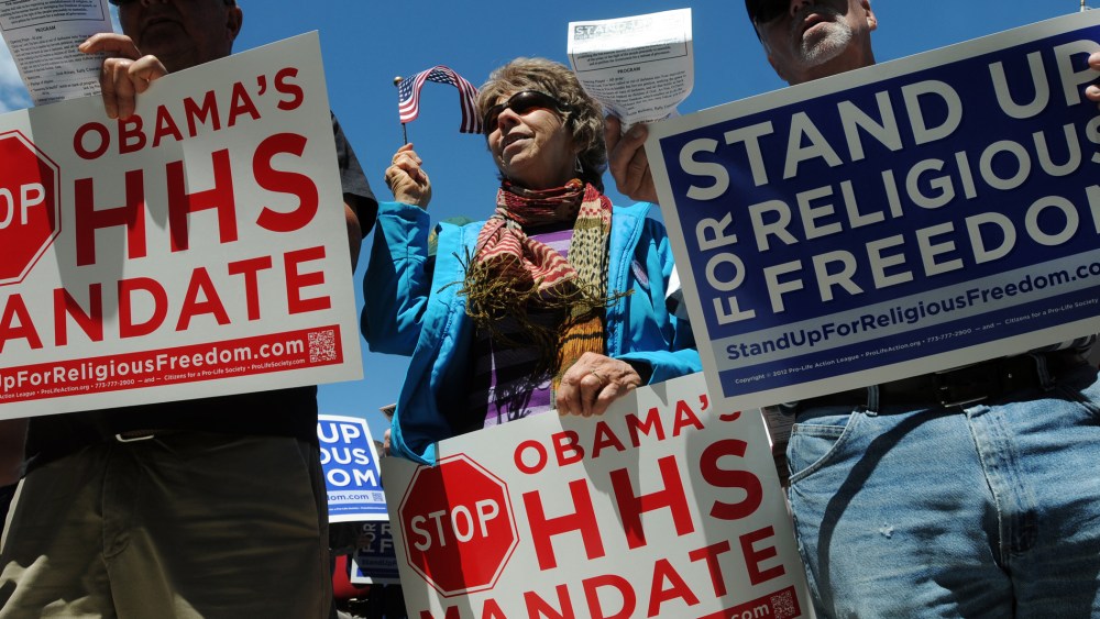 Protesters during a demonstration in opposition of the Obama administration's healthcare mandate for religious institutions, Friday, June 8, 2012 outside the James A McClure Federal Building in Boise, Idaho.