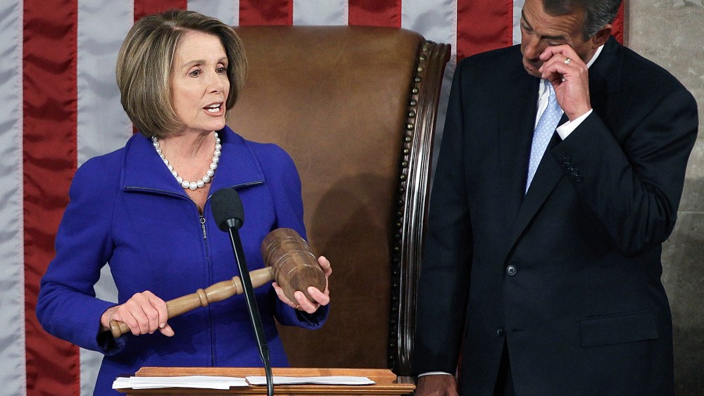 House Speaker John Boehner of Ohio wipes a tear as he waits to receive the gavel from outgoing House Speaker Nancy Pelosi of Calif., on Capitol Hill in Washington, January 5, 2011.