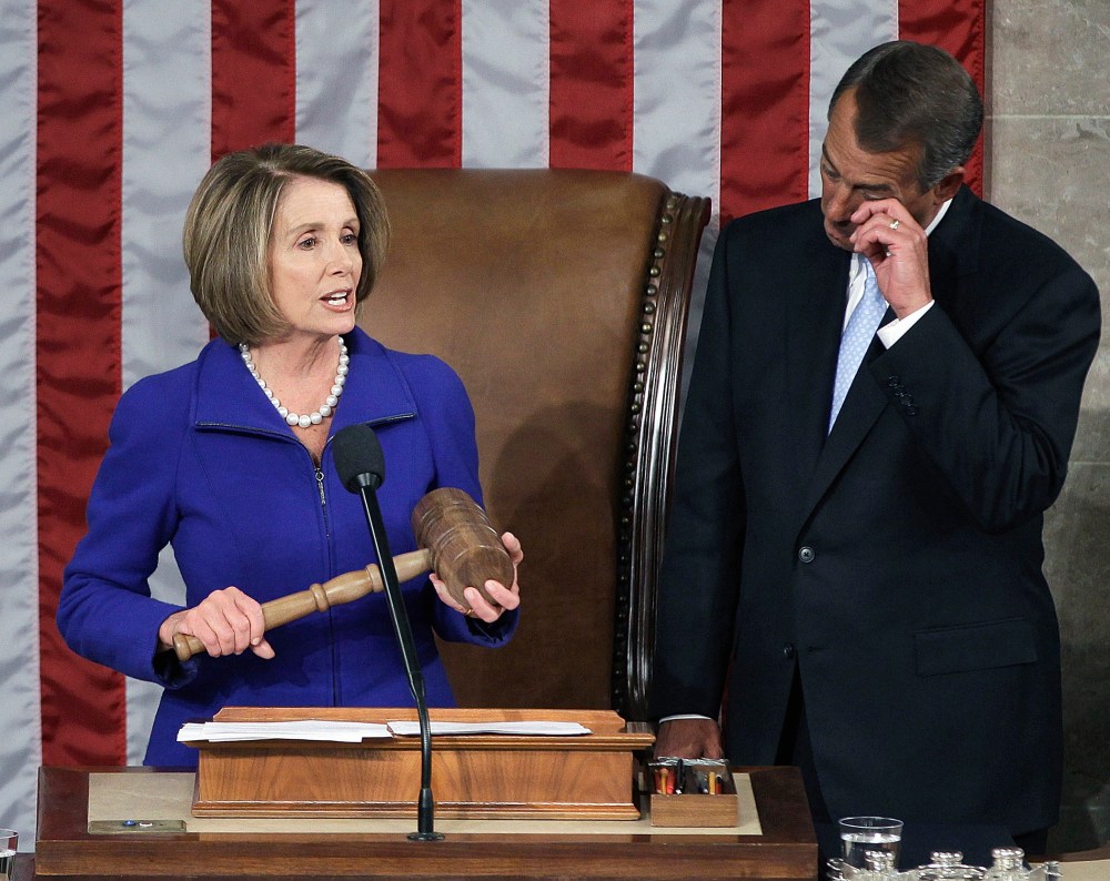 House Speaker John Boehner of Ohio wipes a tear as he waits to receive the gavel from outgoing House Speaker Nancy Pelosi of Calif., on Capitol Hill in Washington, January 5, 2011.