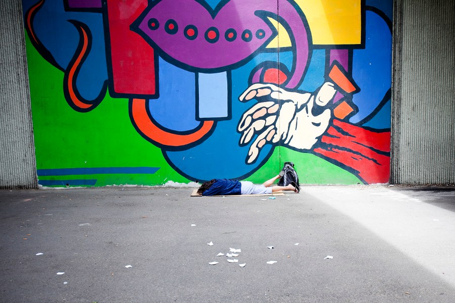 A homeless woman sleeps under the 16th Street bridge in Boise, Idaho on June 25, 2014. (Photo by Kyle Green/The Idaho Statesman)