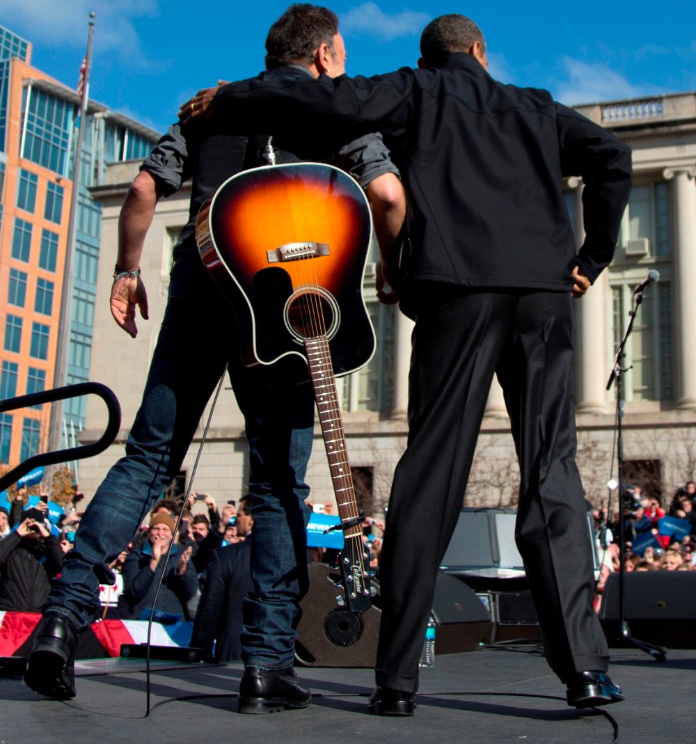 President Barack Obama and singer Bruce Springsteen stand together on stage during a campaign event, Monday, Nov. 5, 2012, in downtown Madison, Wis. (AP Photo/Carolyn Kaster)