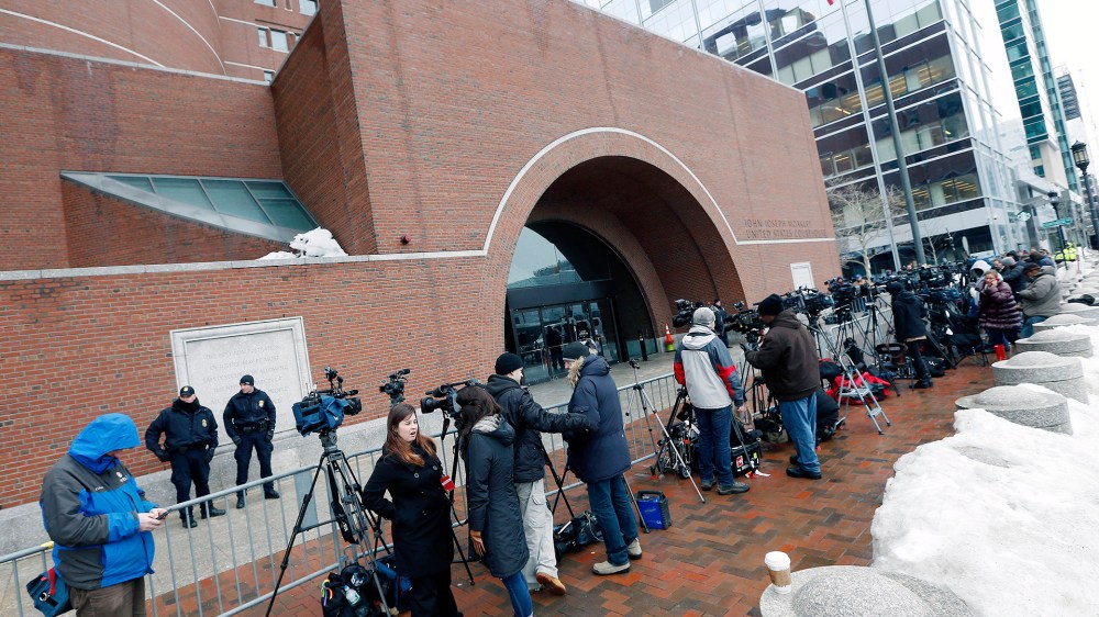 Members of the media wait outside federal court, Wednesday, March 4, 2015, in Boston, on the first day of the federal death penalty trial of Boston Marathon bombing suspect Dzhokhar Tsarnaev