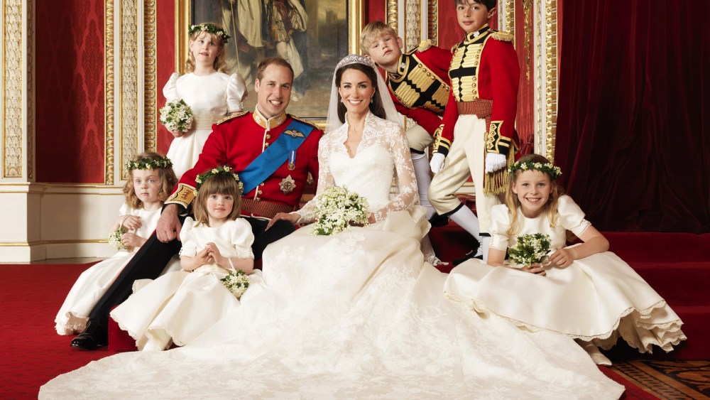 In this photo provided by Clarence House on Saturday, April 30, 2011, Britain's Prince William, center left, and his wife Kate, Duchess of Cambridge, center right, pose for a photograph with, clockwise from bottom right, Margarita Armstrong-Jones,...